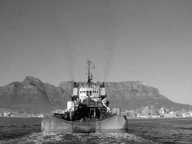 Tug underway in front of Table Mountain, Cape Town